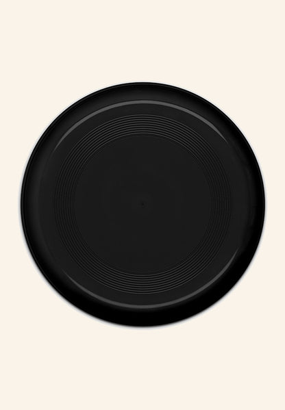 Frisbee en variante noire, disque volant fabriqué en France